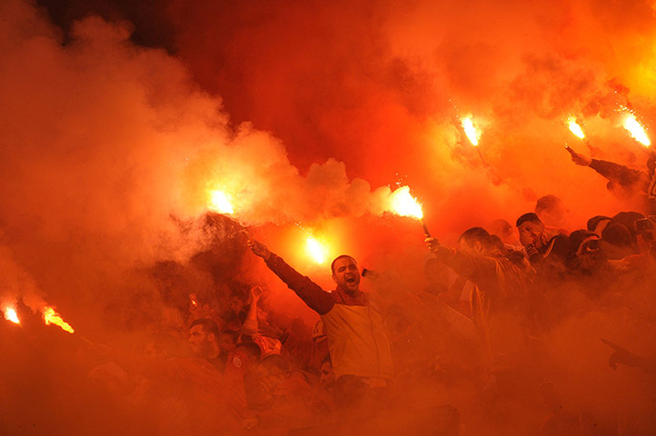 wed champs: Galatasaray's supporters light flares 