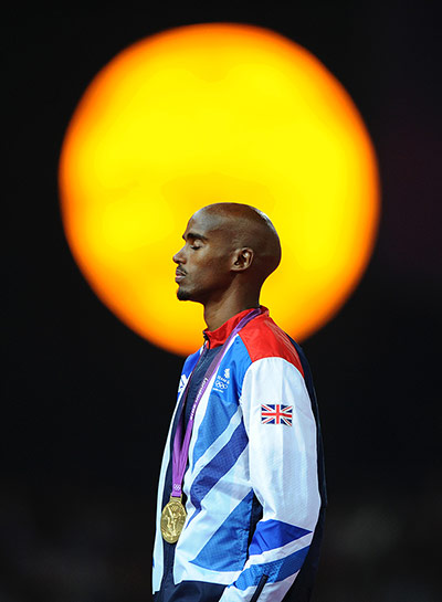 Mo Farah - In Pictures: Mo Farah with gold medal in front of gold light