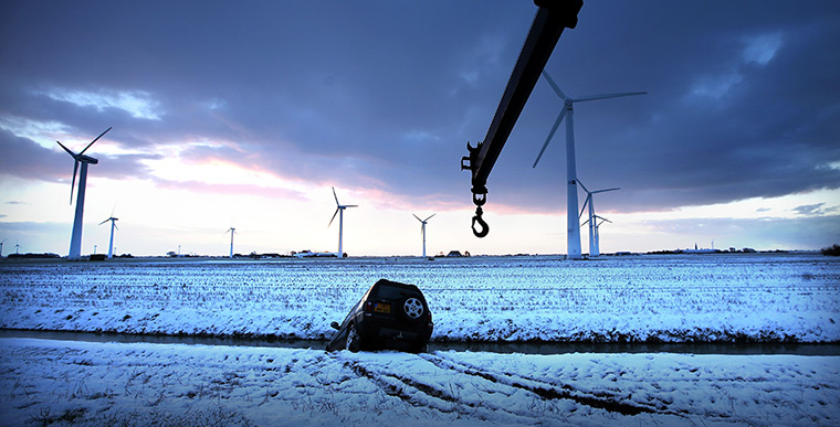 24 hours in pictures: A car is seen off the road due to snowfalls in Zurich 