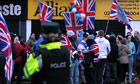 Loyalists protest outside an Alliance party office in Belfast
