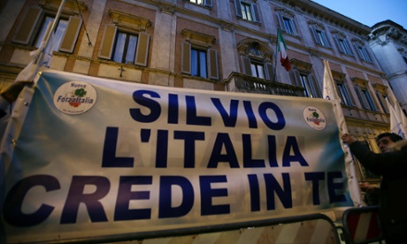 Supporters of former Italian premier Silvio Berlusconi expose a banner reading "Silvio Italy trusts you" in front of Palazzo Grazioli, the residence of Berlusconi, in Rome, Thurdsday, Dec. 6, 2012. 