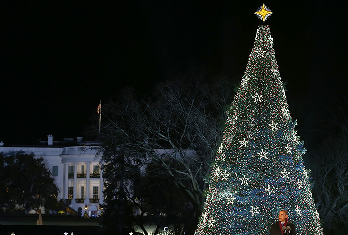 24 hours in pictures: Barack Obama speaks at the lighting of the national Christmas tree in Washington, DC