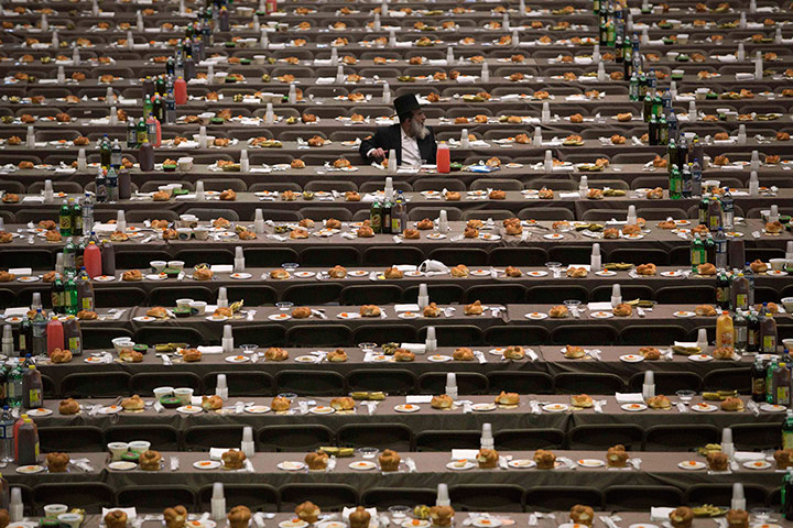 20 Photos: A man alone before a mass gathering for Satmar Hasidic Jews in New York