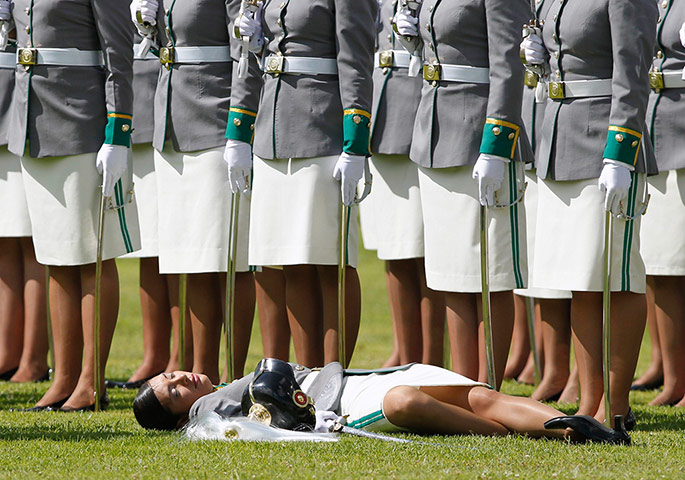 24 hours:  A cadet lies on the grass after collapsing during a promotion ceremony