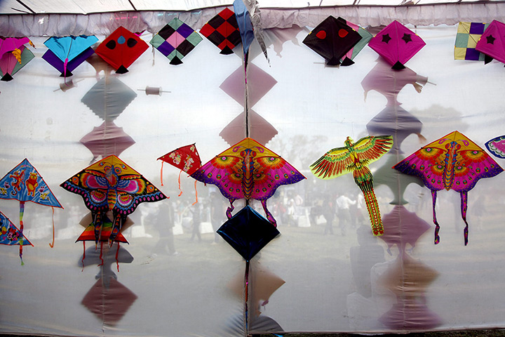 24 hours: New Delhi, India: Kites on display at India Gate during the Delhi International Kite Festival 2012