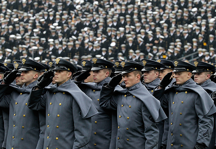 24 hours: Philadelphia, US: Army cadets salute as they march on to an American football field