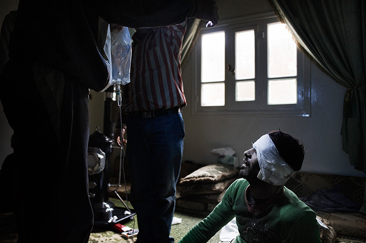 Al-Qusayr Syria: An FSA casualty receives first aid after he was wounded by an RPG