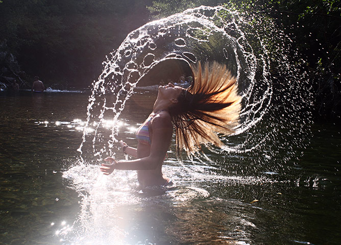 In pictures: splash: Girl flicking hair in water