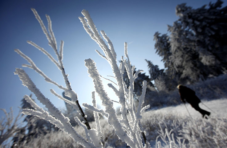 Cold snap continues: A woman walks through the snow at the Feldberg mountain in Schmitten