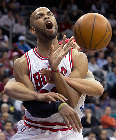 best of the week: Chicago Bulls' Taj Gibson is fouled by New Jersey Nets' Deron Williams