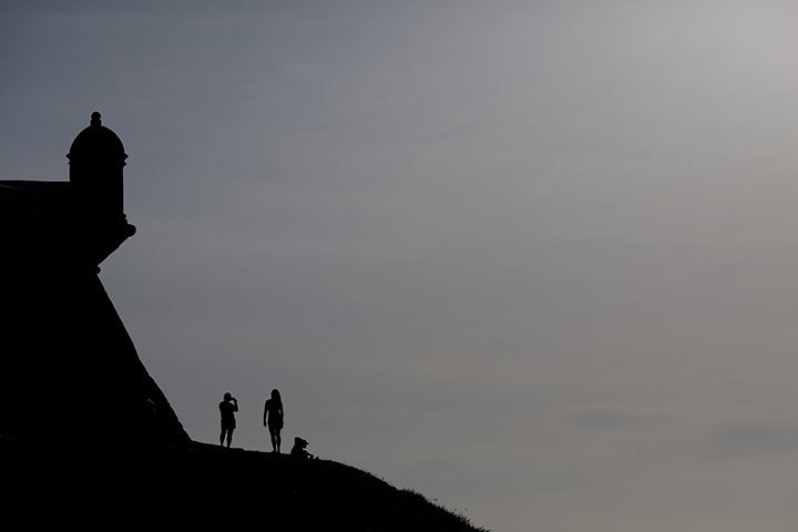 24 hours in pictures: Tourists take photos at the Farol da Barra in Salvador, Brazil