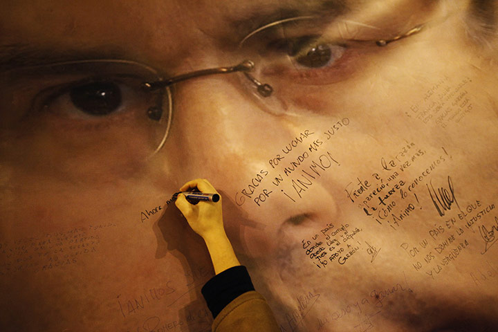 24 hours in pictures: A supporter of Spanish judge Baltasar Garzon in Madrid