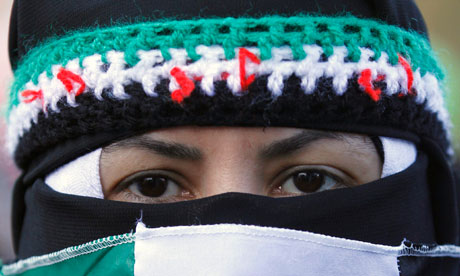 A Syrian woman is masked in