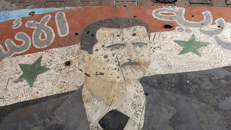 syria2: A painted poster of Syria's President Bashar al-Assad 