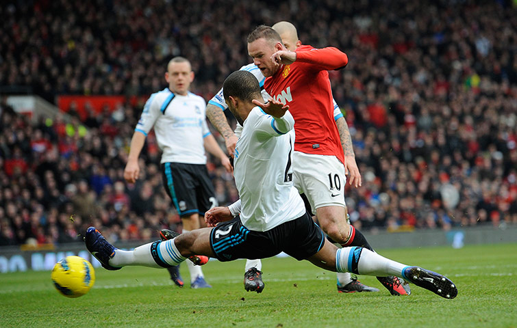 United v Liverpool: Wayne Rooney shoots as Glen Johnson attempts to block
