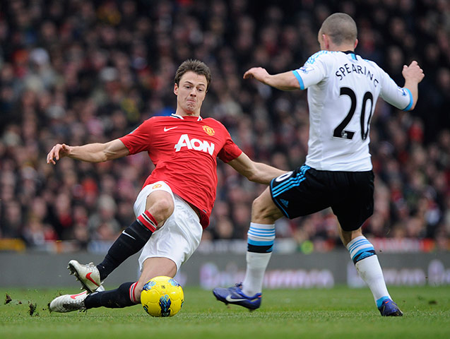 United v Liverpool: Jonny Evans flies in to tackle Jay Spearing