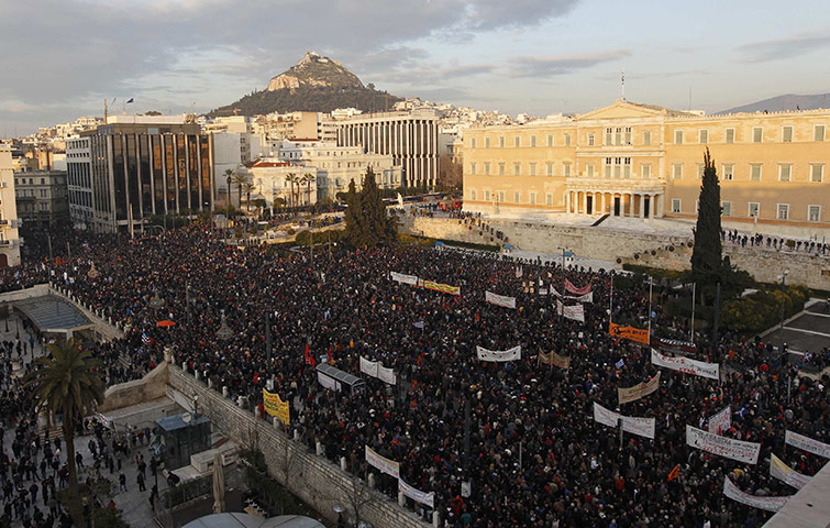 Athens demo: Thousands of people take part in an anti-austerity demonstration in Athens