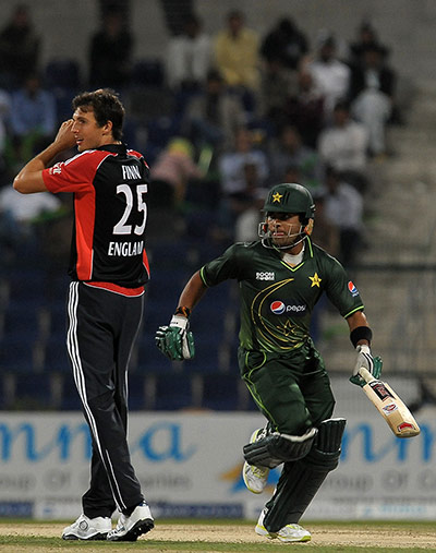 First ODI: Pakistan's Umar Akmal runs as England's Steven Finn looks on