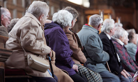 Elderly people listen to a tour guide ahead of publication of British Pensions Commission report