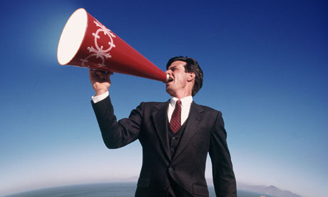 A man shouting through a megaphone 