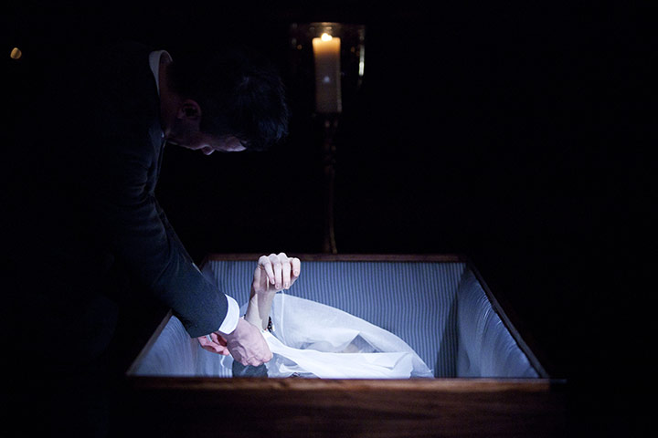 24 hours in pictures: A model has her clothes adjusted at Thom Browne show duriggn fashion week