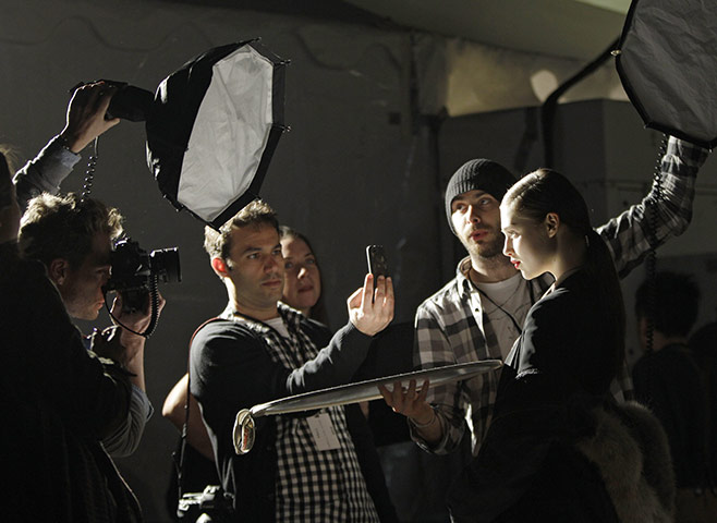 24 hours: New York City, US: A model poses for photographers backstage 