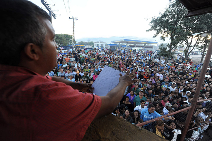 Honduras prison fire: An official reads a list of deceased inmates to a crowd of relatives 