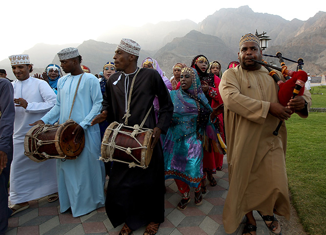 24 hours: Wadi Dayqah, Oman: Men and women perform a traditional dance 