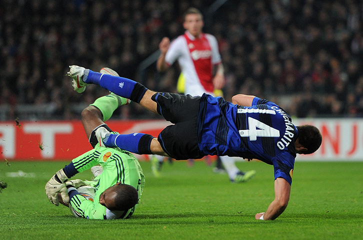 Ajax v United: Ajax keeper Kenneth Vermeer stops Javier Hernandez of Manchester United 