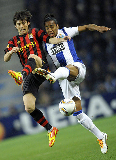 Porto v City: David Silva vies for the ball with Alvaro Pereira