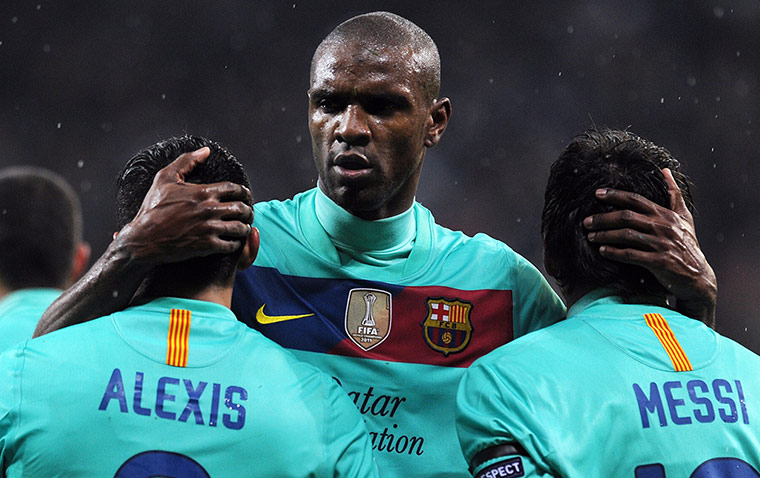 Best of the week: Barcelona's Eric Abidal cradles team-mates Alexis Sanchez and Lionel Messi