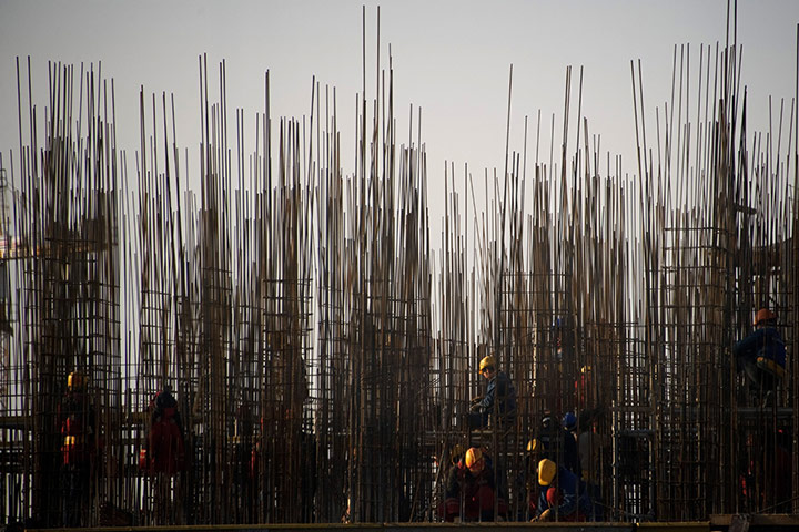 24 hours: Sochi, Russia: Workers build a platform at the 2014 Olympic venue