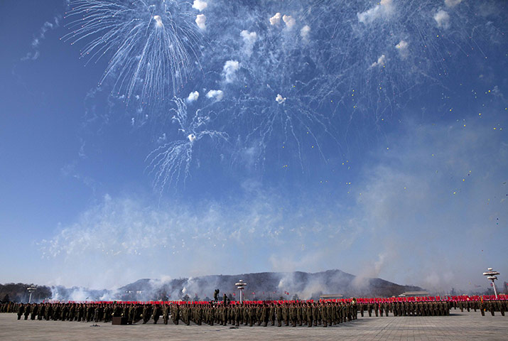 24 hours: Pyongyang, North Korea: Fireworks explode over the heads of soldiers