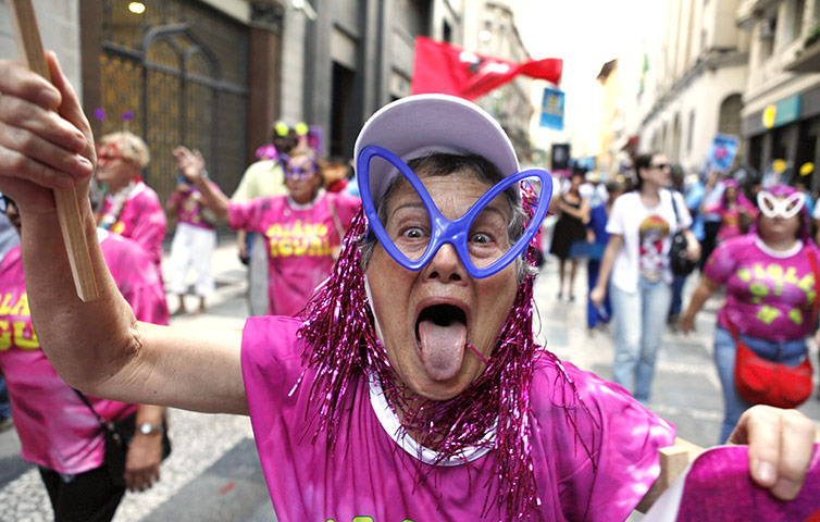 24 hours: Sao Paulo, Brazil: Maria, 72, gestures during the Bloco dos Bancarios party