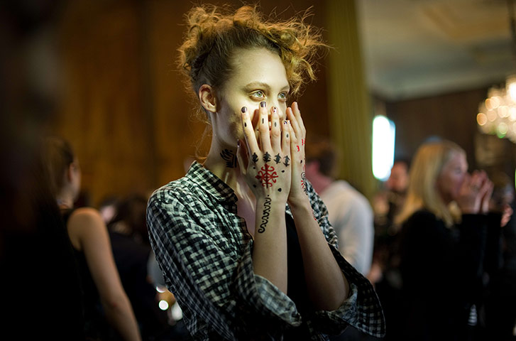 London Fashion Week: A model has her make-up applied ahead of the Vivienne Westwood show
