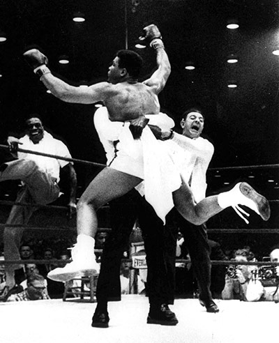 Angelo Dundee: Cassius Clay is lifted off the ring floor in Miami Beach