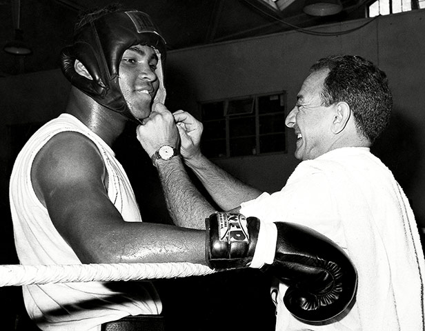 Angelo Dundee: Angelo Dundee adjusts Muhammad Ali'ss head protector