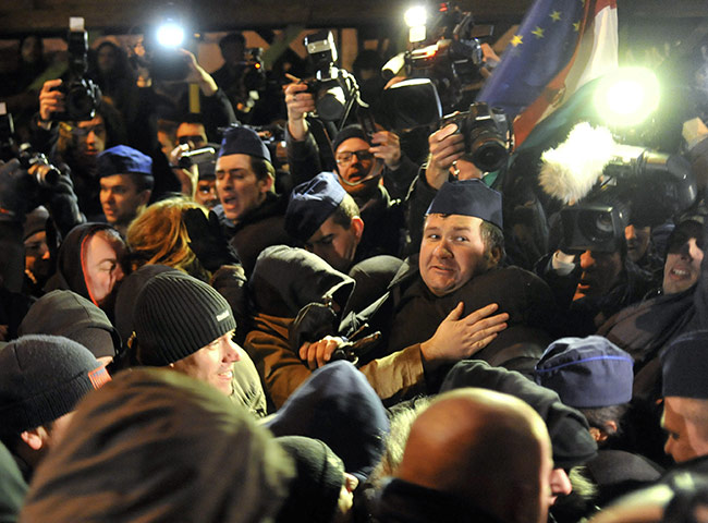 24 hours in pictures: Budapest, Hungary: Police officers and far-right demonstrators clash
