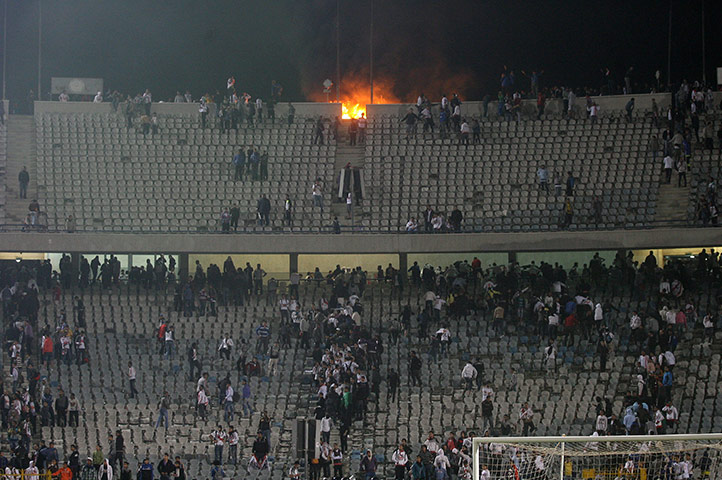 Port Said clashes: Fans start a fire at Cairo International Stadium in protest