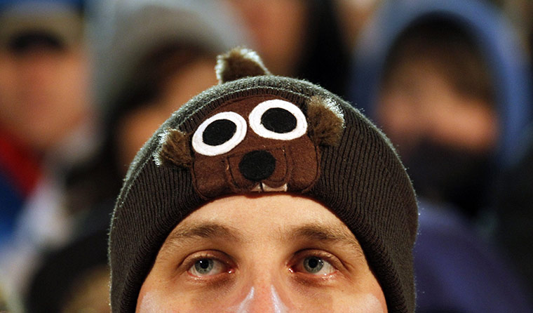 Groundhog day: A man in an estimated crowd of 18,000 people waits on Gobbler's Knob