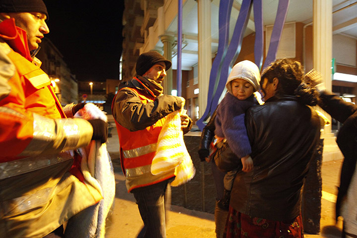 Europe weather: Red Cross give blankets to a homeless Romanian woman Nice, France