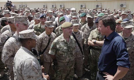 David Cameron with British and US troops at Camp Bastion in Afghanistan. Photograph: Lefteris Pitarakis/PA Defence spending cuts