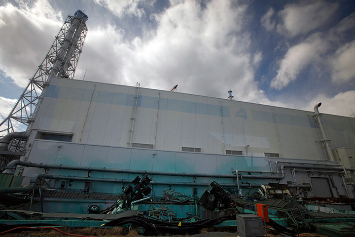inside Fukushima: upturned trucks lie around the no.4 reactor