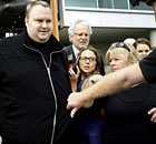 Kim Dotcom, founder of Megaupload, leaves court in New Zealand after being granted bail.