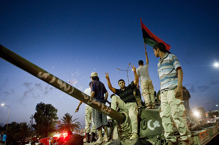 Remi Ochlik: Libyans celebrate following the official declaration of liberation