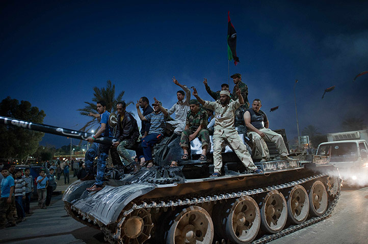 Remi Ochlik: Libyans celebrate following the official declaration of liberation
