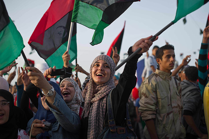 Remi Ochlik: Libyans celebrate following the official declaration of liberation