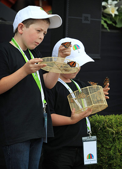 Christchurch memorial: Cameron Lucas, 8, and his brother Tyler, 6, release butterflies