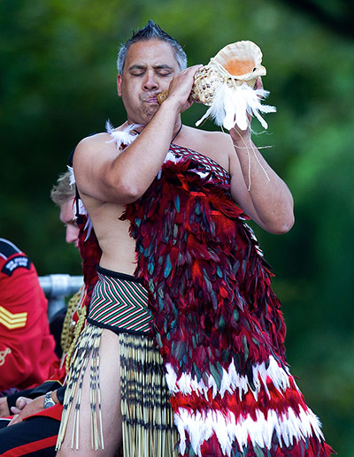 Christchurch memorial: A Maori warrior blows a putatara shell during the remembrance service