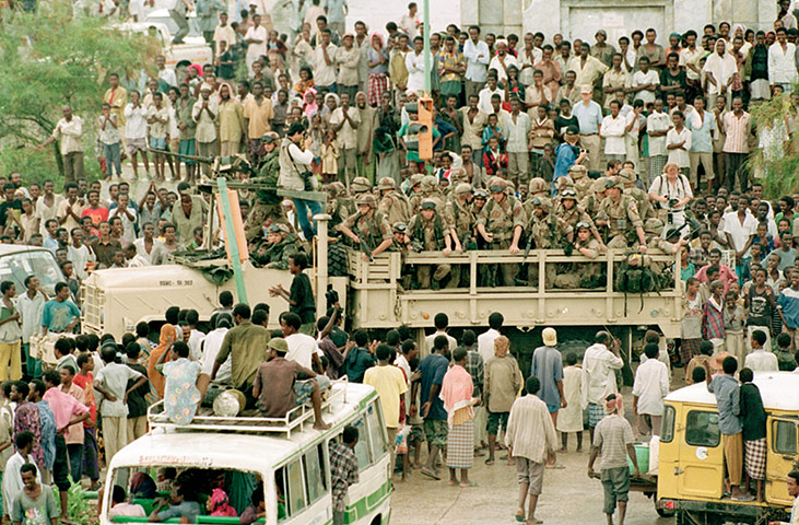 Somalia timeline: Mogadishu residents surround a truck carrying US marines